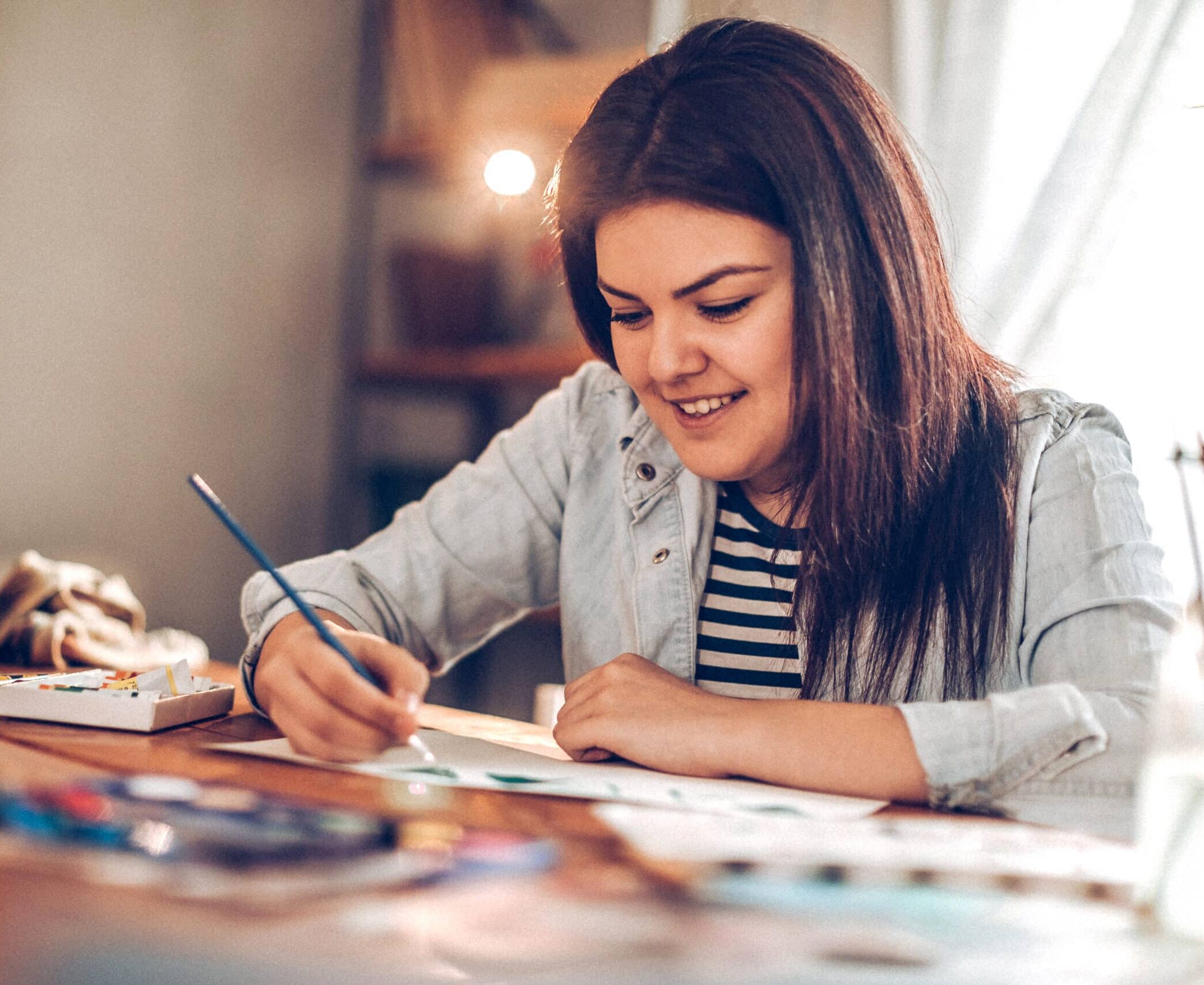 young person painting