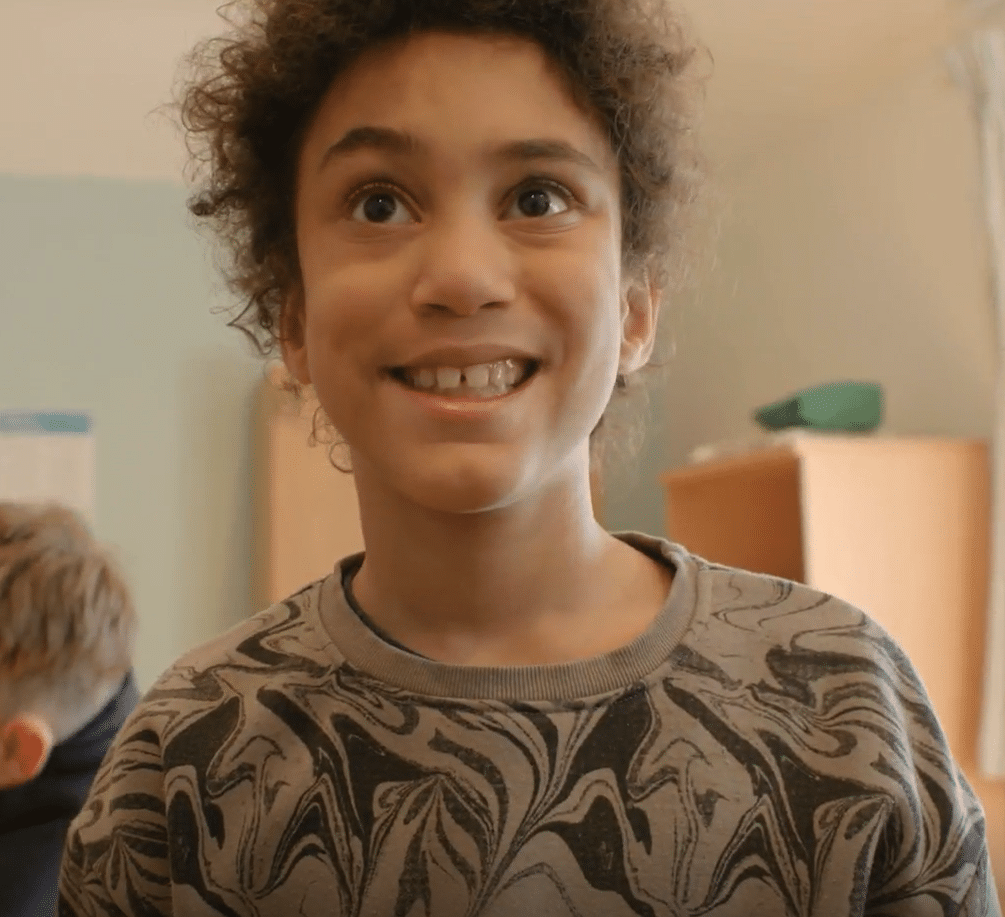 Pupil smiling in class