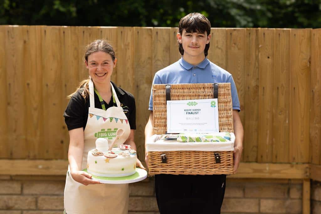 Pupil and teacher celebrating their baking awards